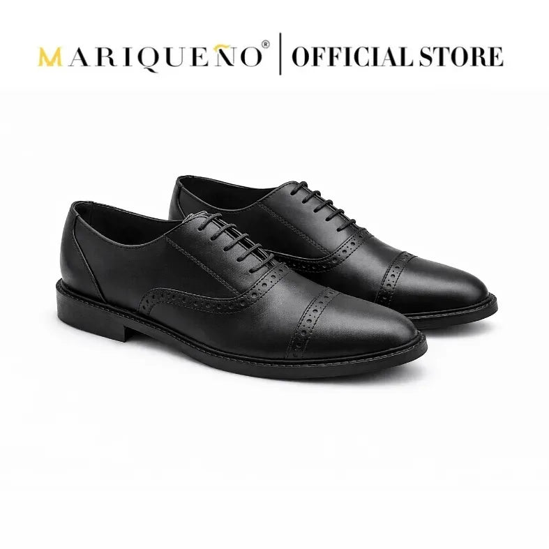 Black oxford with holes shoes with 'Mariqueno' branding on a white background
#color_black