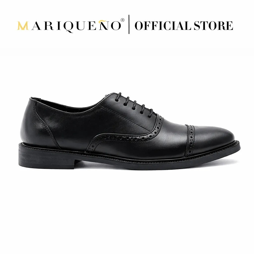 Black Oxford leather with holes shoe with 'Mariqueno' branding on a white background
#color_black