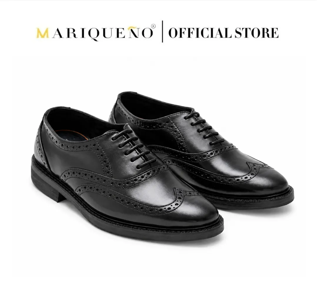 Black wingtip oxford shoes with 'Mariqueno' branding on a white background
#color_black
