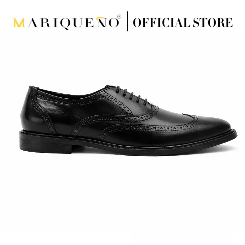 Black leather wingtip oxford shoe with 'Mariqueno' branding on a white background
#color_black