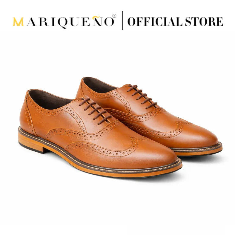 Pair of tan brown leather shoes with 'Mariqueno' branding on a white background
#color_tan