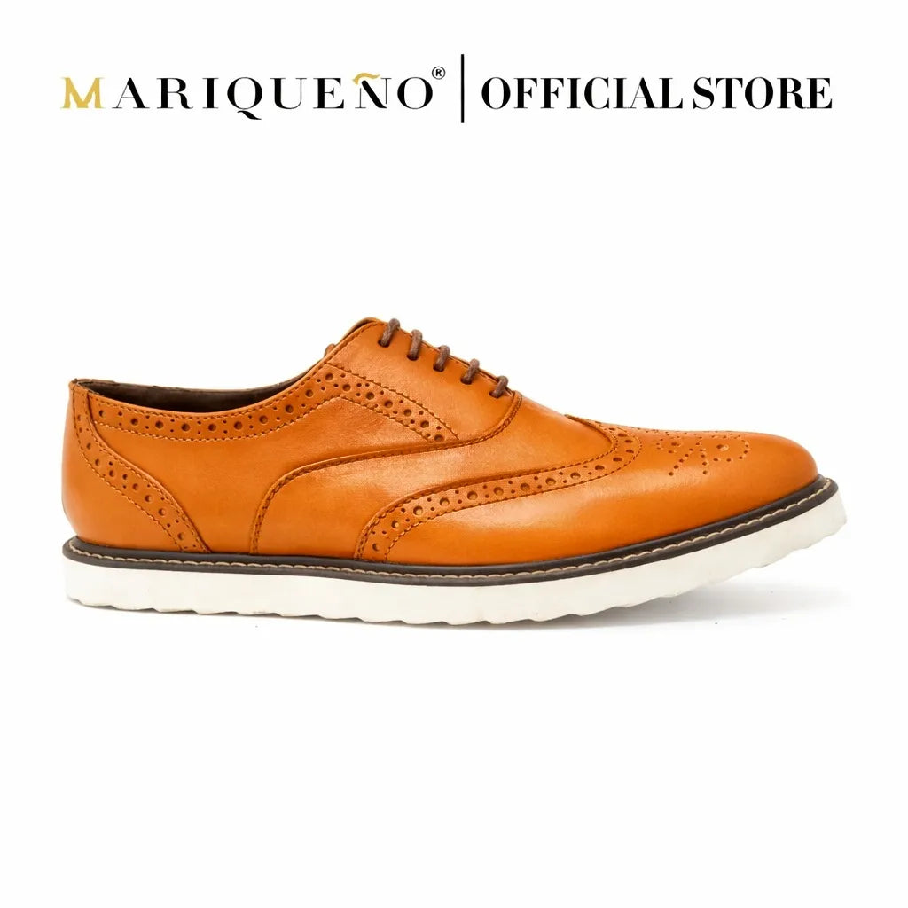 Tan brown leather shoe with white rubber sole on a white background, branded as Mariqueno.
#color_tan