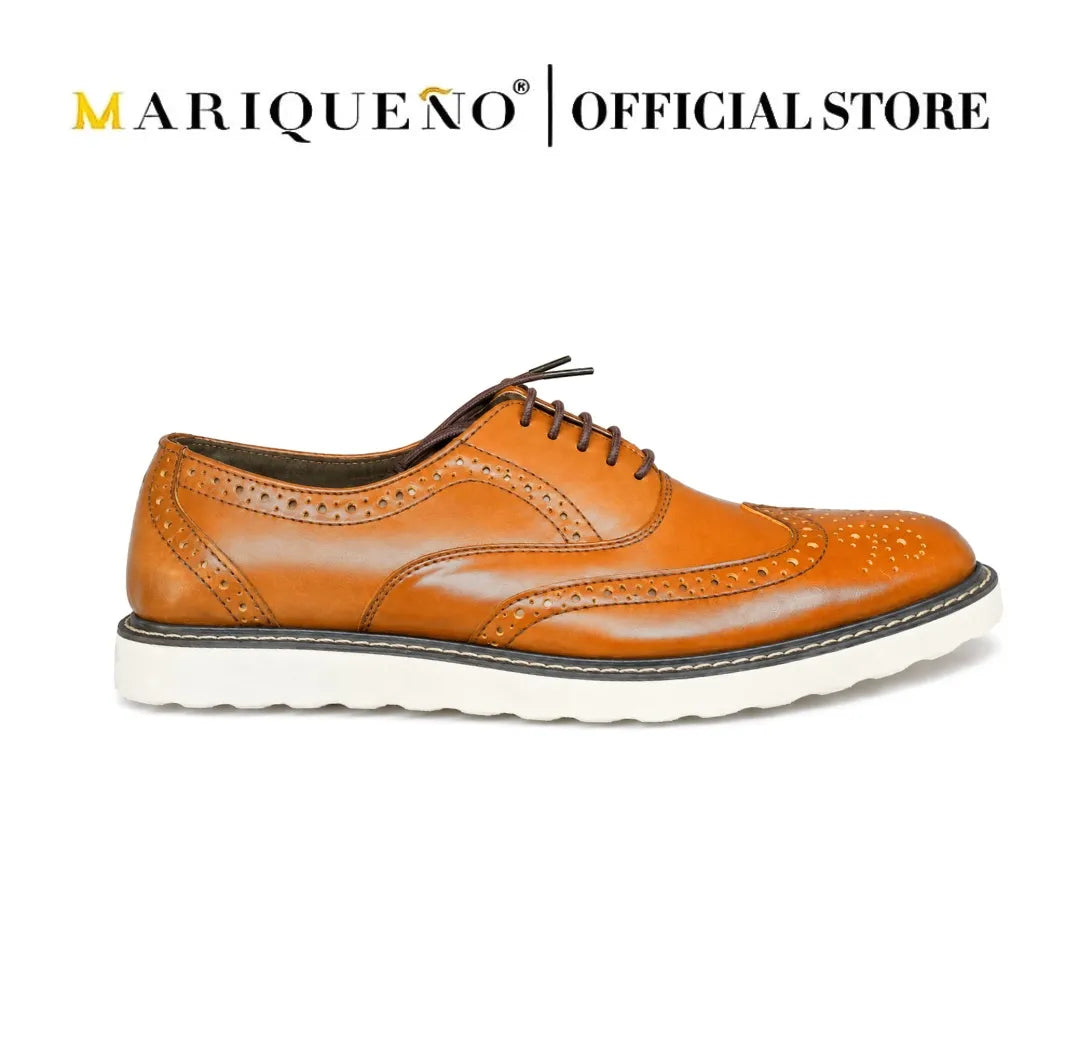 Tan brown leather shoe with white rubber sole on a white background, branded as Mariqueno.
#color_tan