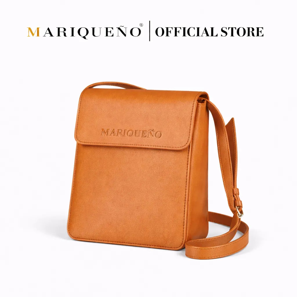 Tan brown leather crossbody bag with 'Mariqueno' branding on a white background
#color_tan