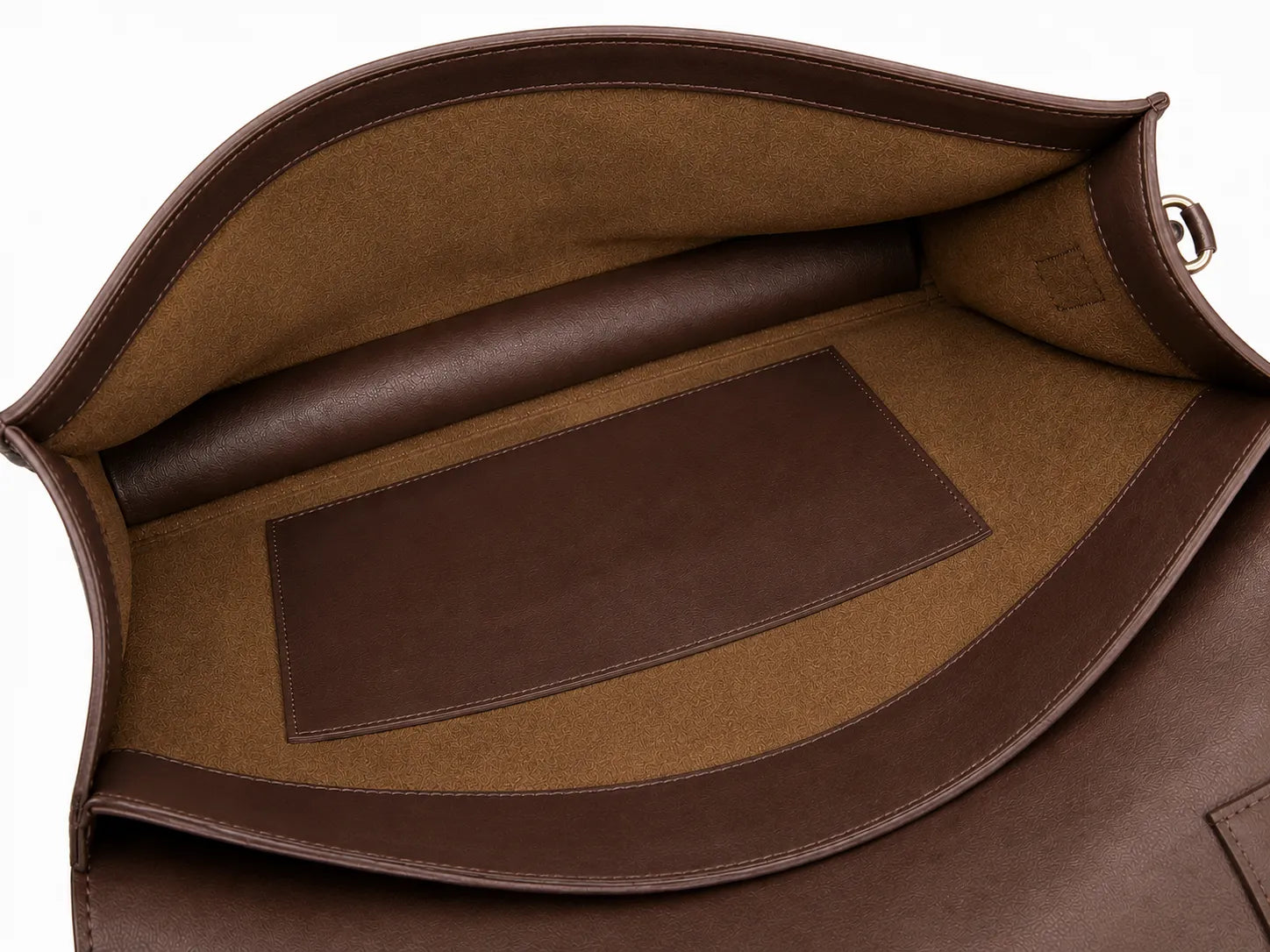 Close-up of a brown leather bag with a visible brand label.
#color_walnut