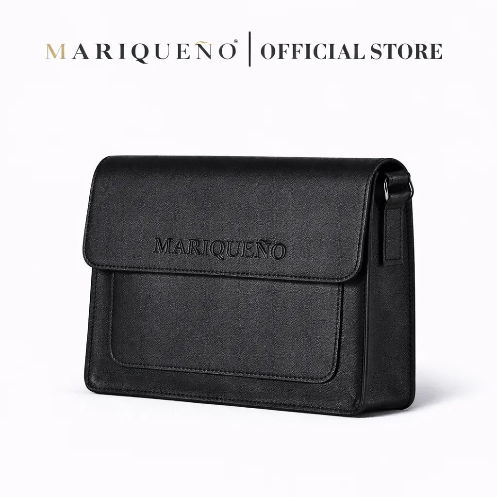 Black leather top handle bag with 'Mariqueno' branding on a white background
#color_black