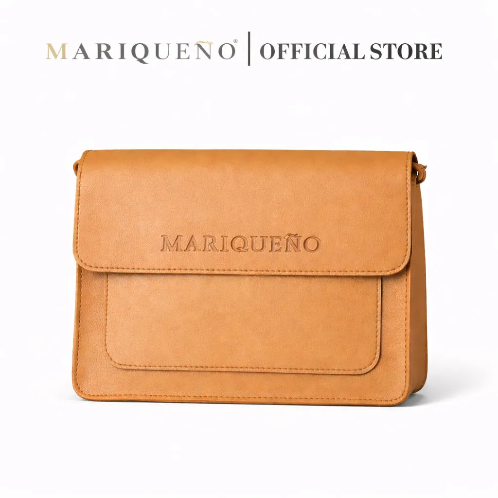 Tan leather bag with 'Mariqueño' branding on a white background
#color_tan
