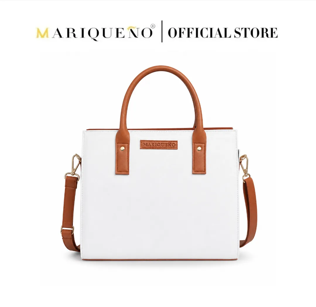 White handbag with brown handles and strap on a white background, featuring the Mariqueno logo.
#color_white