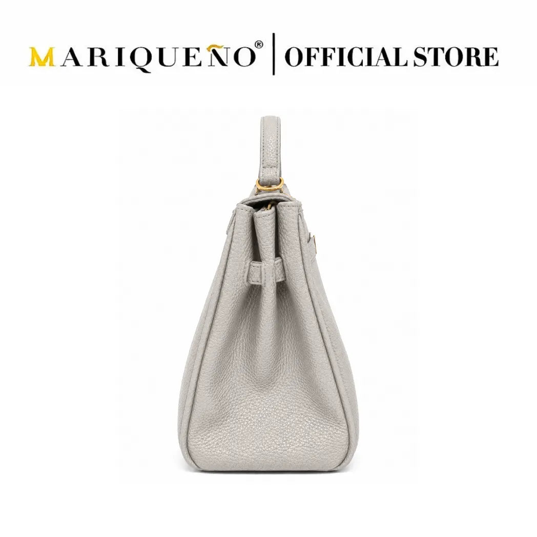 A light gray pebbled leather shoulder bag with a top handle and drawstring detail, shown against a plain white background with 'MARIQUEÑO | OFFICIAL STORE' text at the top.
#color_gray