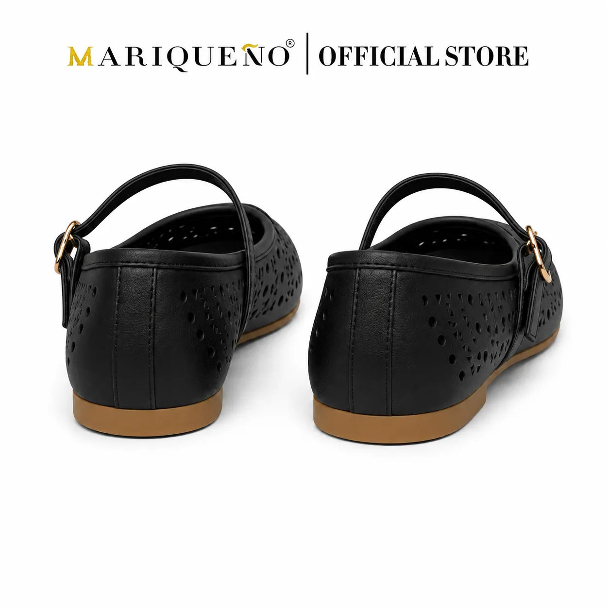 A pair of black flat shoes with perforated details, Mary Jane straps, and gold-tone hardware, shown from the back on a white background with 'MARIQUENO | OFFICIAL STORE' text at the top.
#color_black