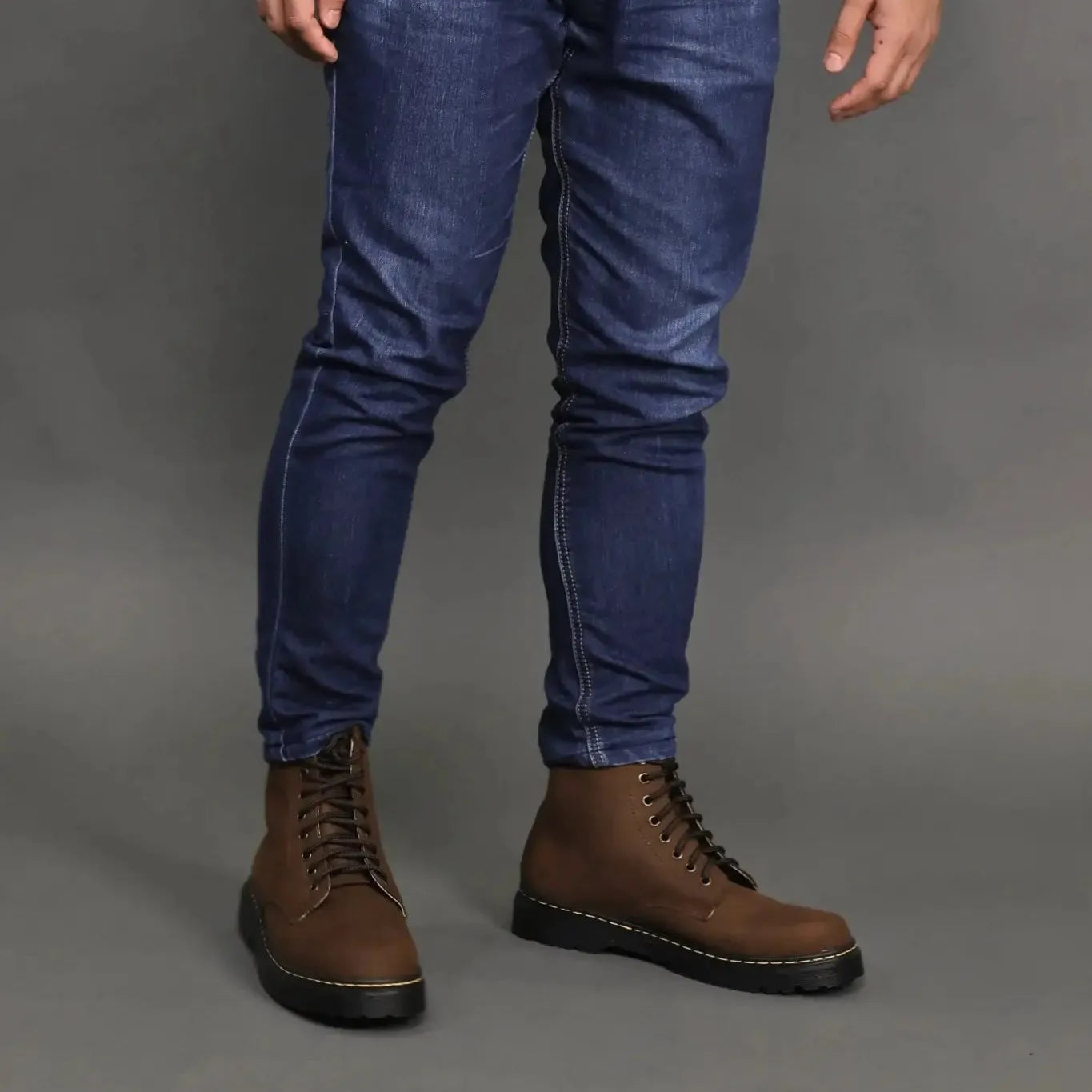 Model wearing a pair of brown matted high cut boots
#color_malt brown