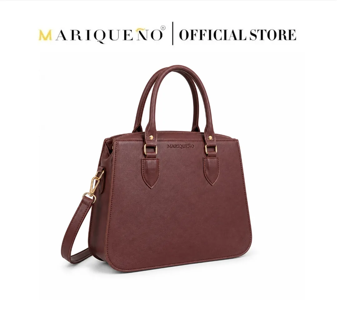 Brown handbag with gold accents on a white background, featuring the Mariqueño brand.
#color_choco brown