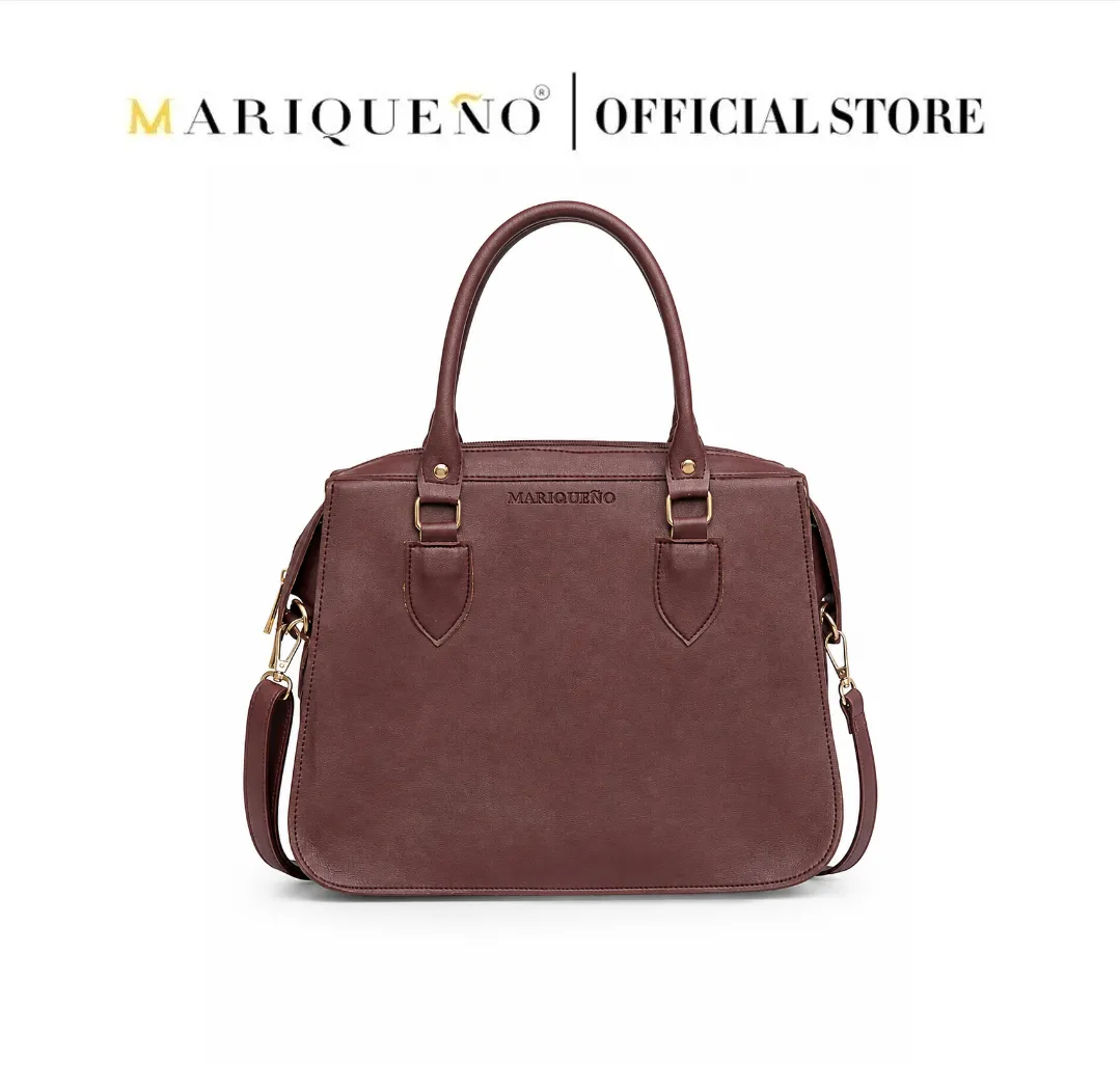 Brown handbag with gold accents on a white background, featuring the Mariqueano brand.
#color_choco brown
