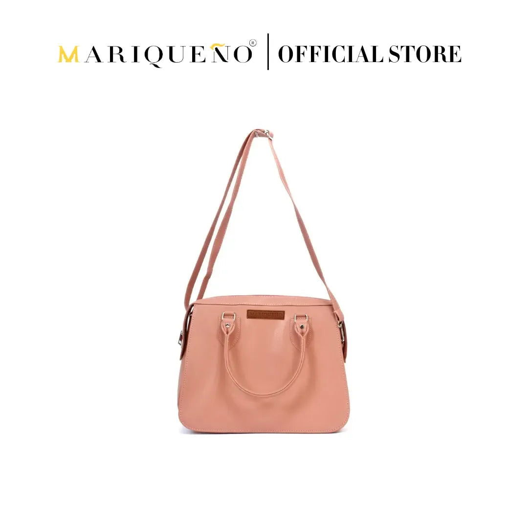 Pink handbag with shoulder strap on a white background, featuring the Mariqueño brand.
#color_salmon pink