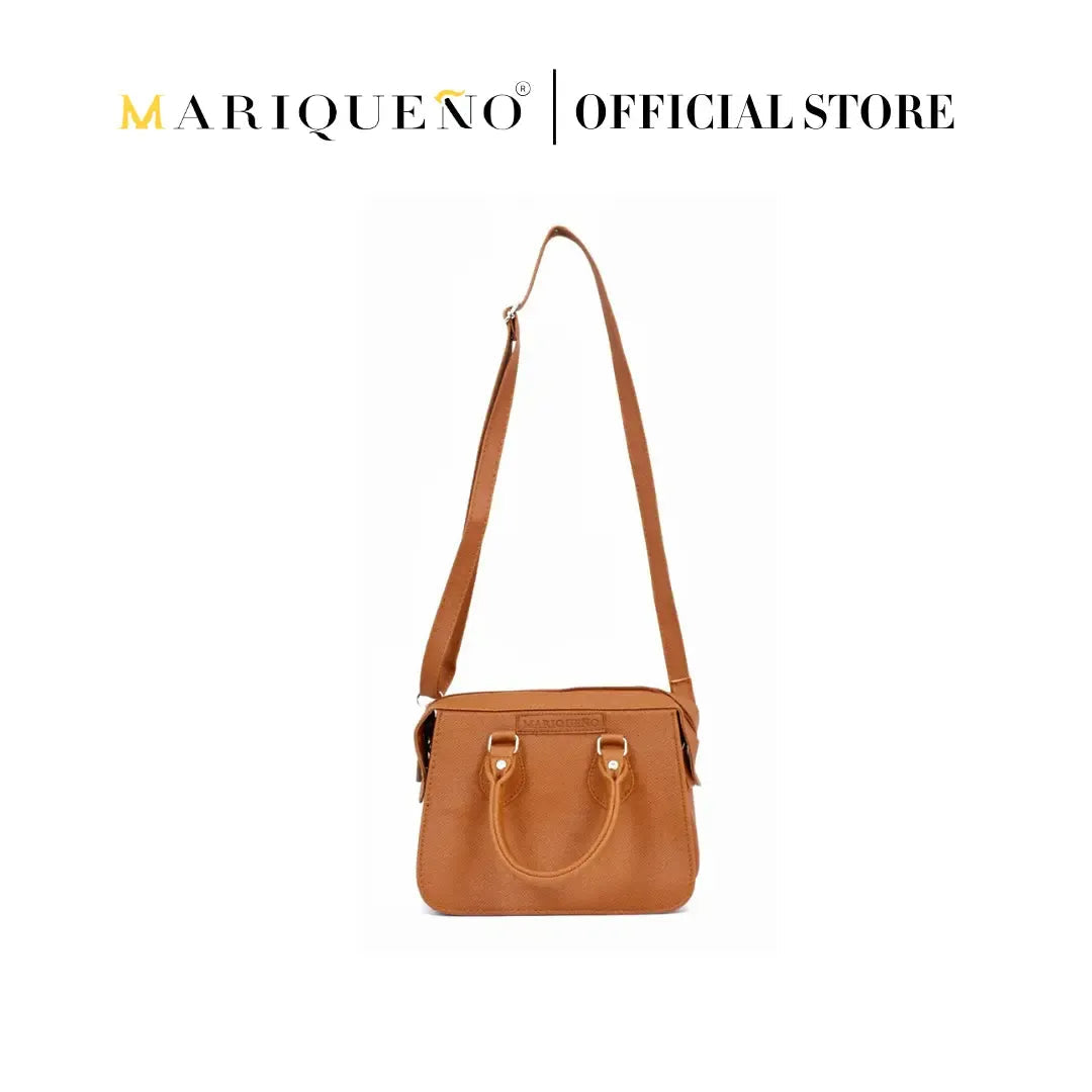 Brown handbag with a strap on a white background, featuring the Marqueéno brand.
#color_tan brown