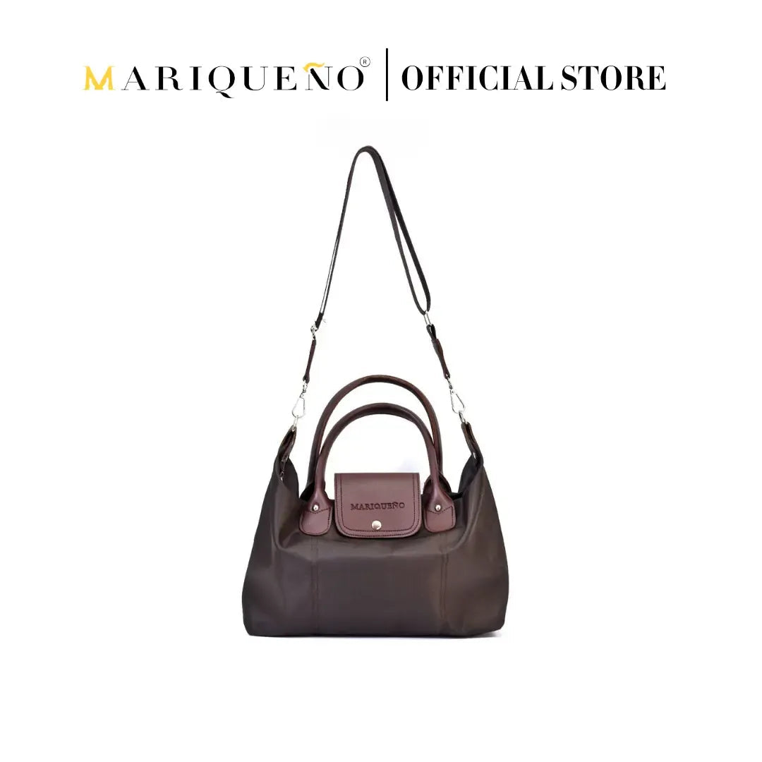 Brown handbag with a visible brand logo on a white background, featuring color options.
#color_choco brown