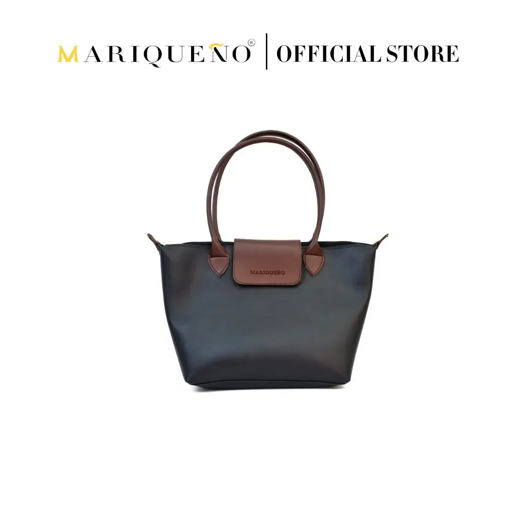 Black handbag with brown handle and patch on a white background, featuring Mariqueno branding.
#color_black