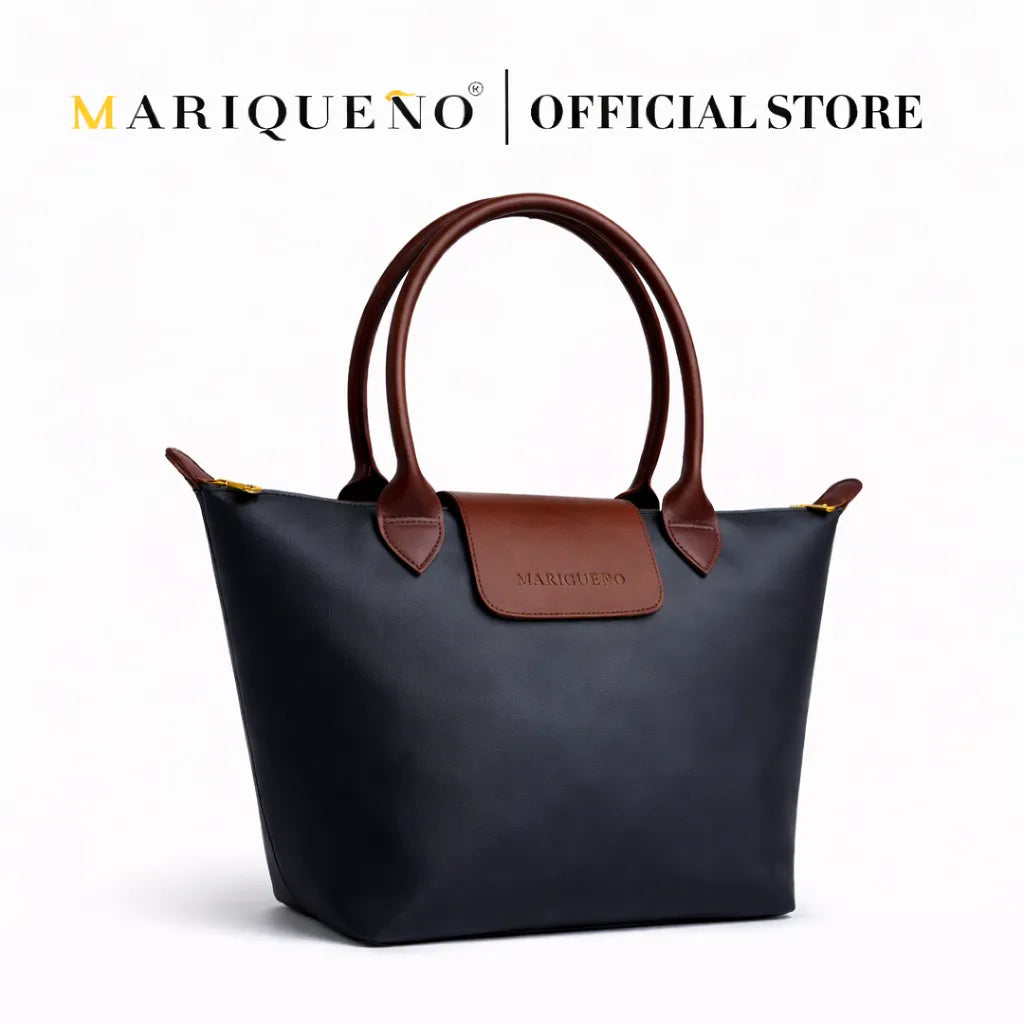 Black handbag with brown accents on a white background, featuring the Marqueéno brand.
#color_black