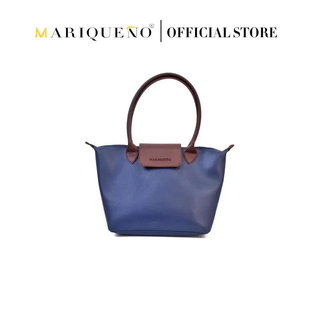 Blue handbag with brown handle and trim on a white background, featuring Mariqueno branding.
#color_blue