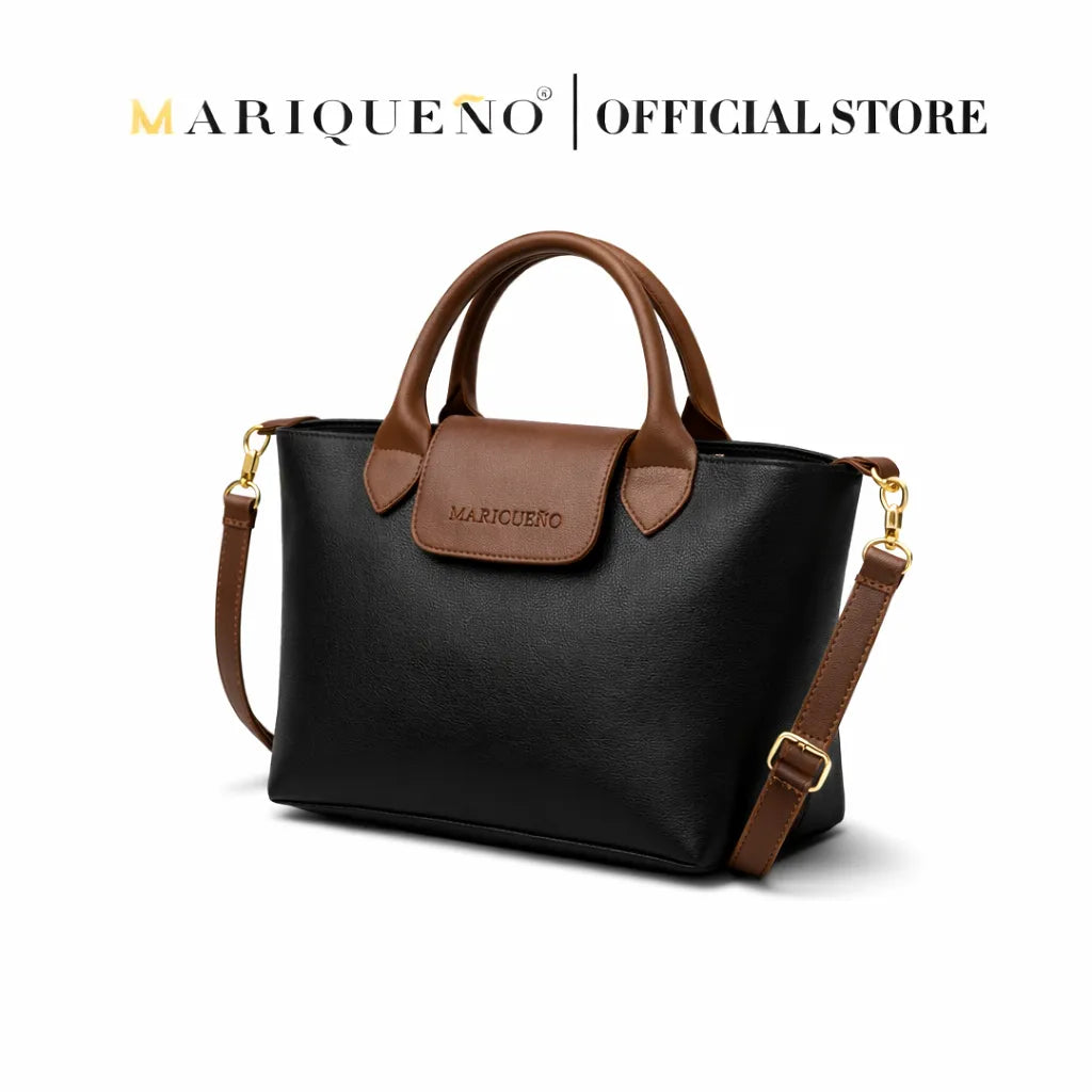 Black handbag with brown accents and strap, featuring Mariqueno branding on a white background.
#color_black