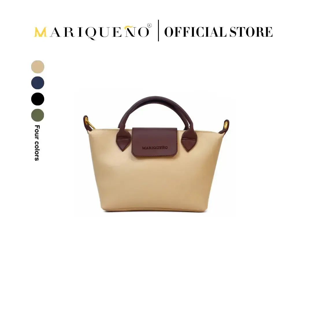 Beige handbag with brown handle and accents, featuring Mariqueño branding on a white background.
#color_cream