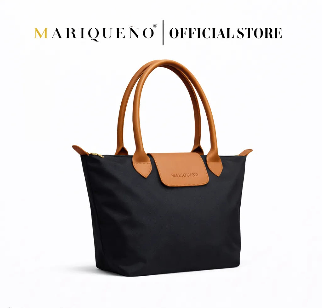 Black handbag with brown handles and trim on a white background, featuring the Mariquenoo brand.
#color_black