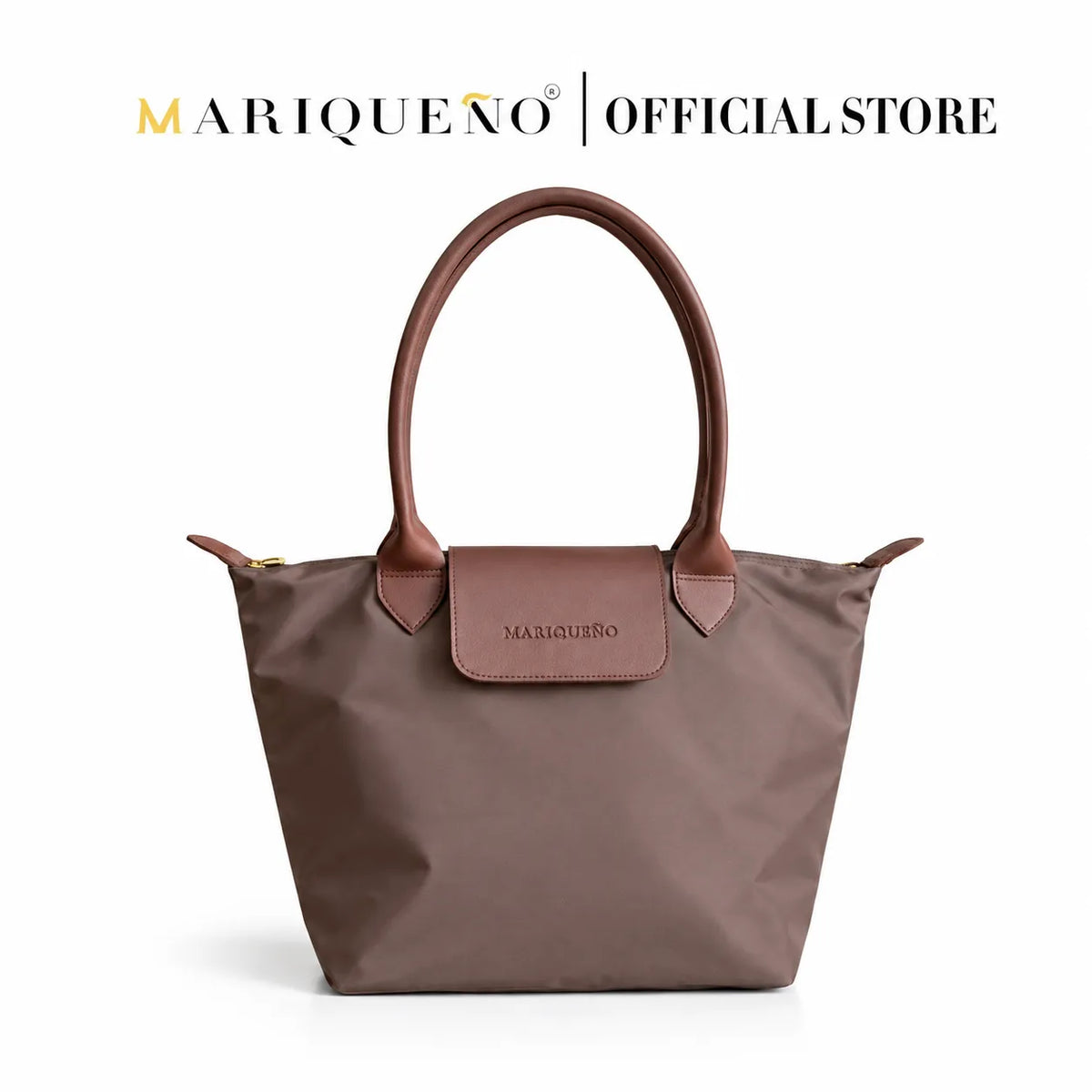 Brown handbag with leather handles and trim on a white background, featuring the Mariqueño brand.
#color_choco brown