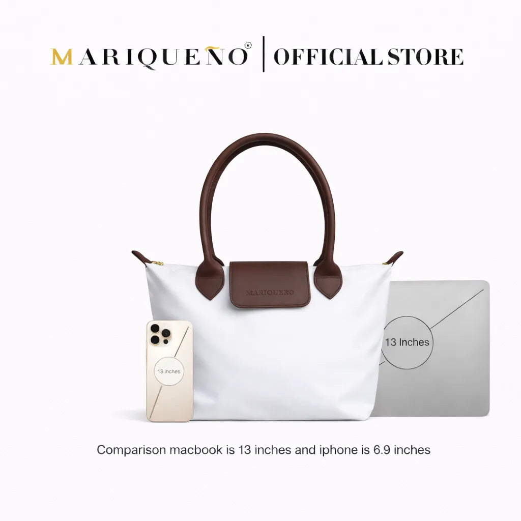 White handbag with brown handles and a phone and laptop for size comparison on a white background, branded as Mariqueno.
#color_white