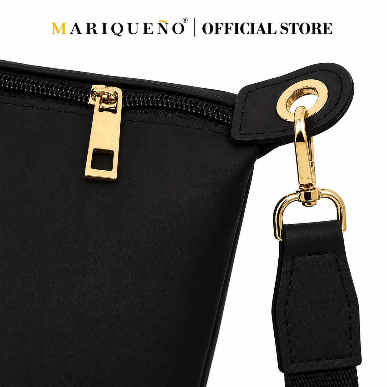 Black bag with zipper and strap detail, featuring Mariqueno brand.
#color_black
