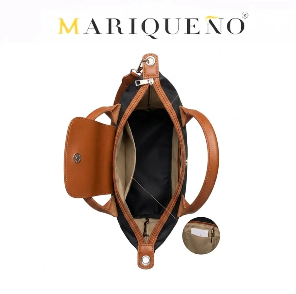 Brown leather handbag with open design on a white background, featuring the brand 'Mariqueno'.
#color_black and tan