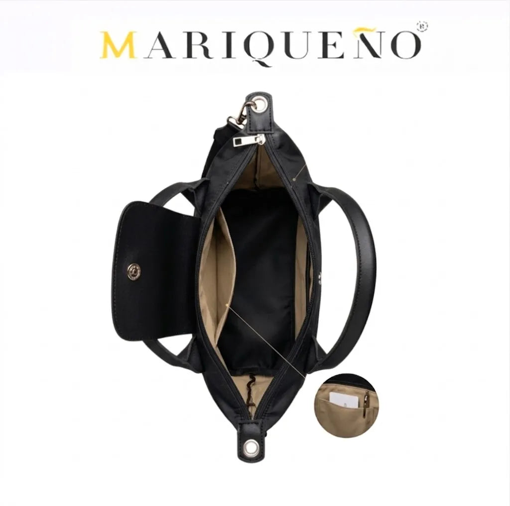 Black handbag with open design on a white background, featuring the Mariqueno brand.
#color_black