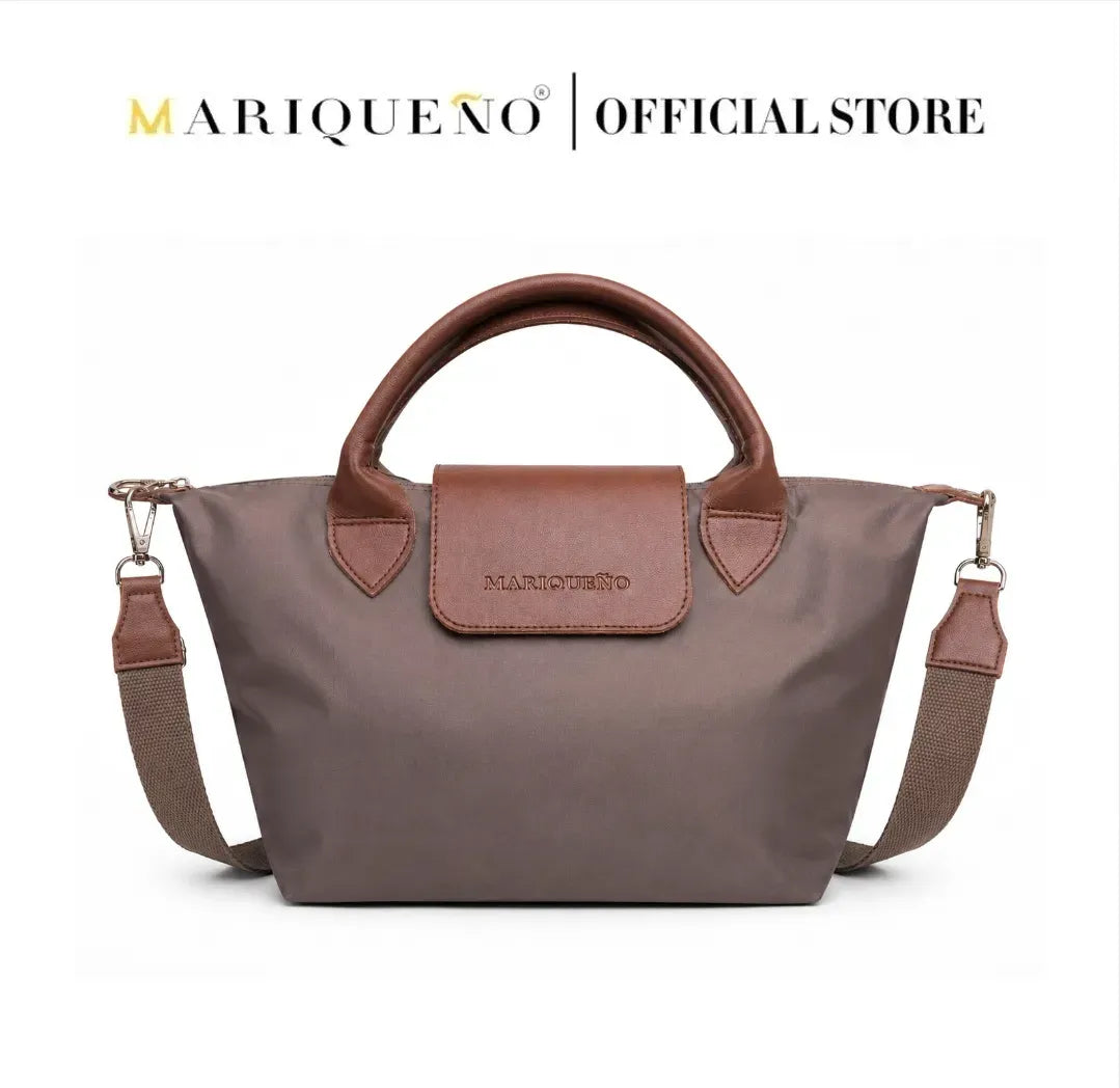Brown handbag with a visible brand logo on a white background, featuring color options.
#color_choco brown
