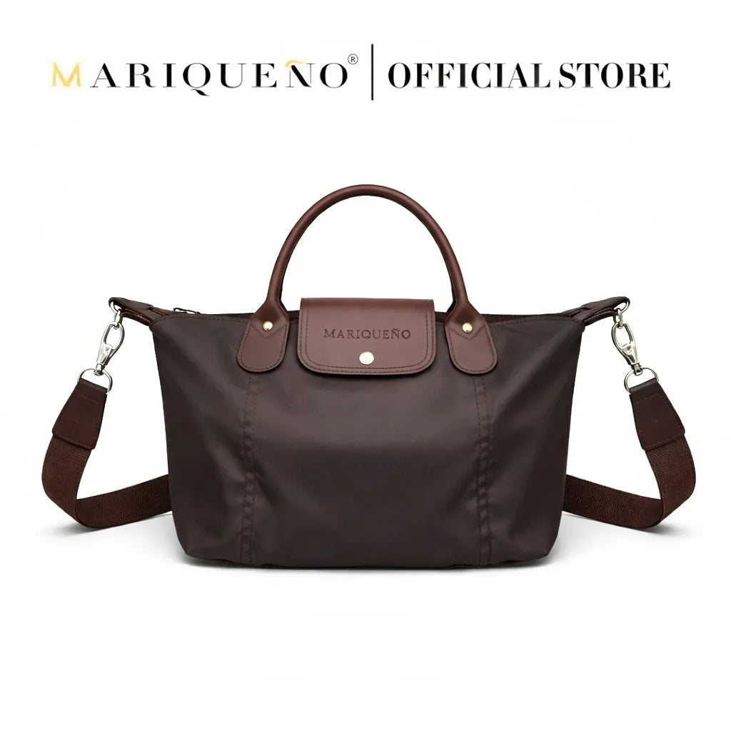 Brown handbag with a visible brand logo on a white background, featuring color options.
#color_choco brown