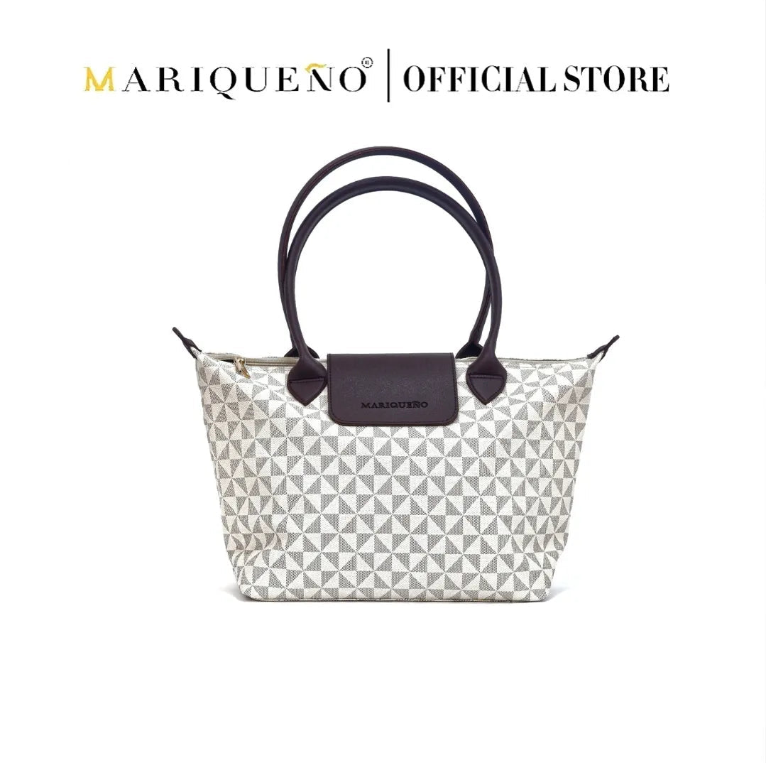 Marqueano handbag with geometric pattern and black accents on a white background
#color_sandstone geo