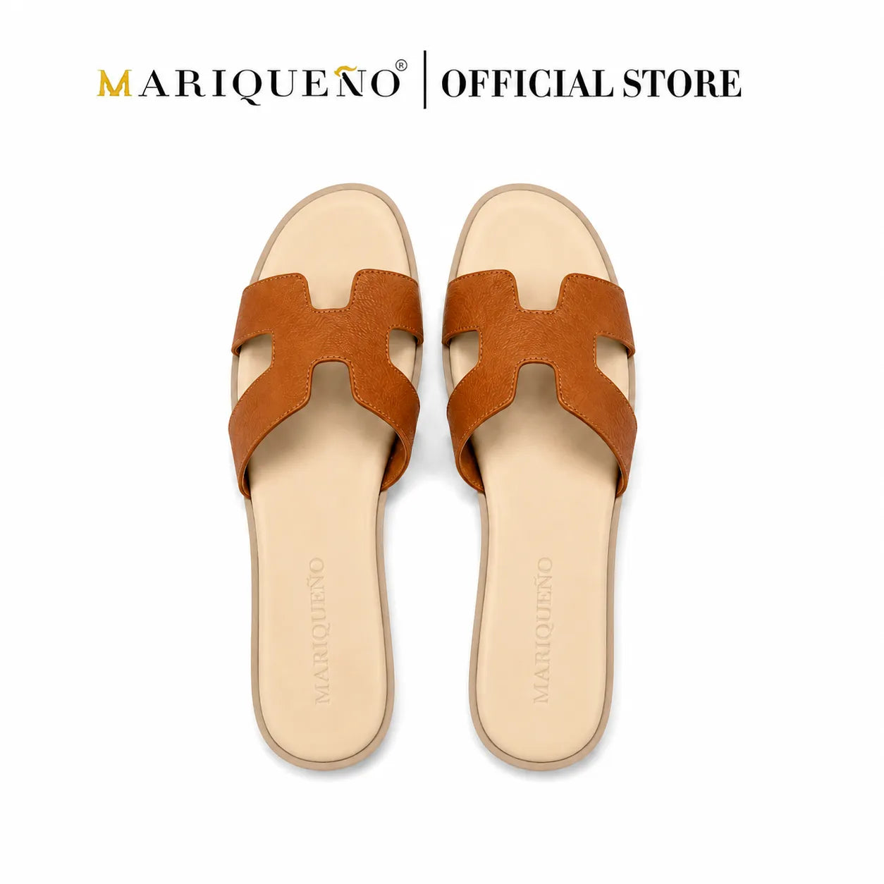 A pair of Mariqueno slide sandals with a brown H-shaped strap and a beige footbed, shown from a top-down view on a white background with 'MARIQUEÑO | OFFICIAL STORE' text at the top.
#color_tan