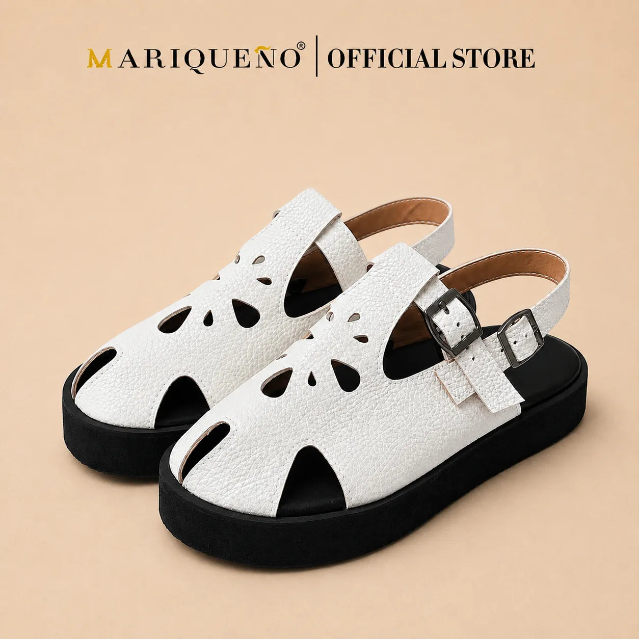 A pair of white textured leather slingback sandals with black soles and cutout details on the toe and sides, shown against a plain white background with 'MARIQUENO | OFFICIAL STORE' text at the top.
#color_white