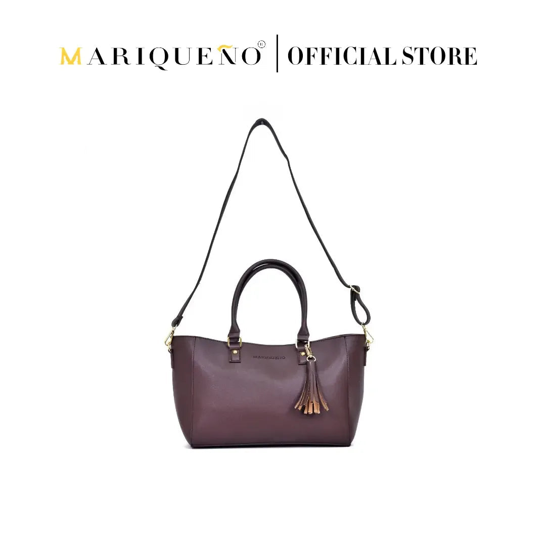 Purple handbag with gold accents on a white background, featuring the Mariqueno brand.
#color_choco brown