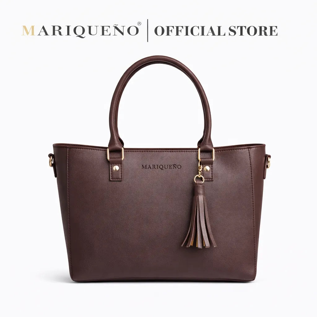 Purple handbag with gold accents on a white background, featuring the Mariqueno brand.
#color_choco brown