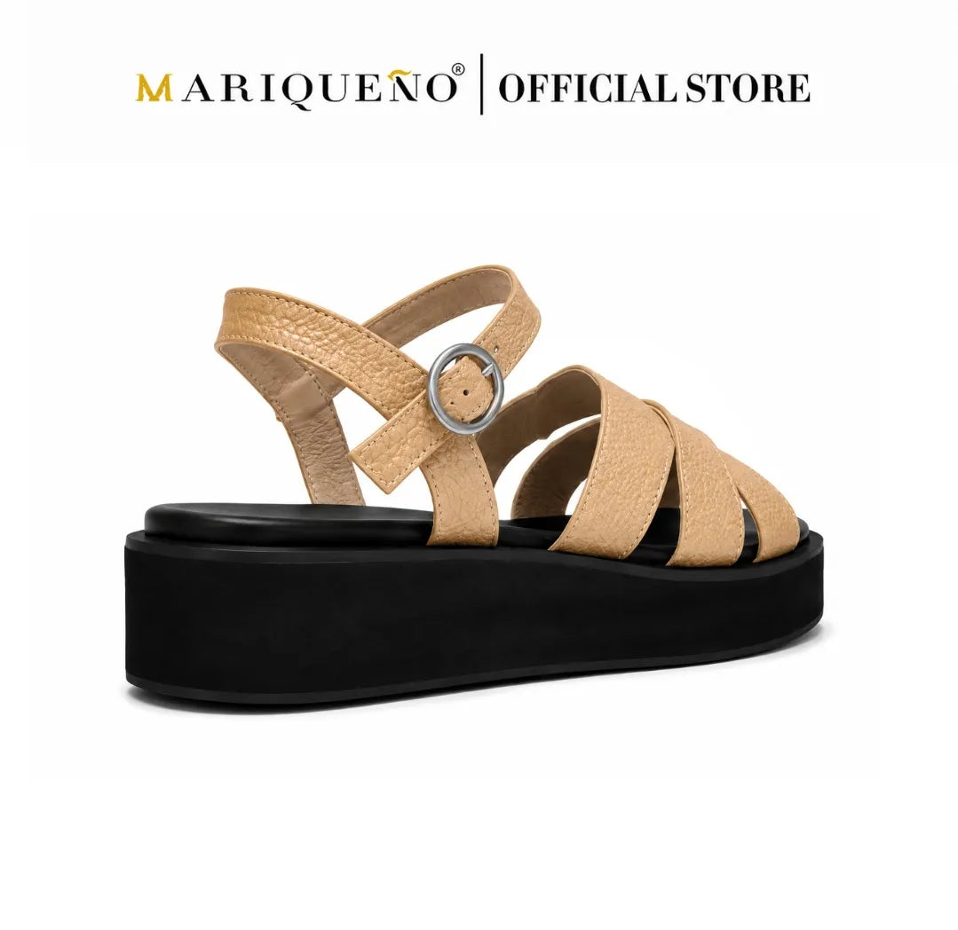 A single Mariqueno platform sandal with textured beige leather straps and a black platform sole, shown on a white background with the 'MARIQUEÑO | OFFICIAL STORE' logo at the top.
#color_beige