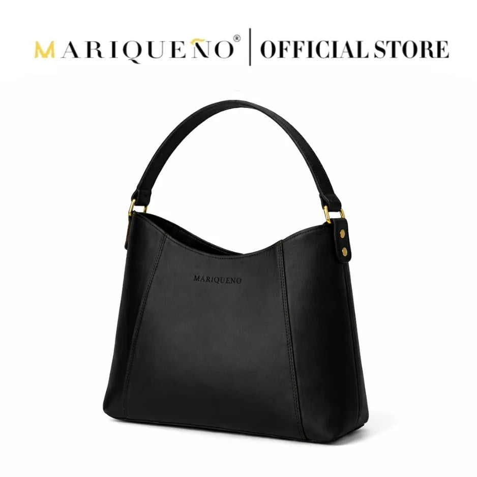 Black handbag with gold accents on a white background, featuring the Mariqueno brand.
#color_black