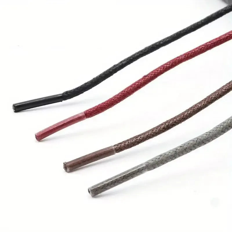 Four braided cables in black, red, brown, and gray on a white background