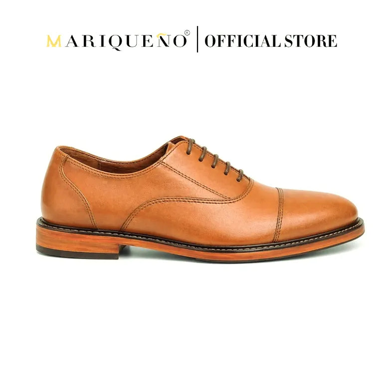 Tan brown leather shoe with 'Mariqueno' branding on a white background
#color_tan