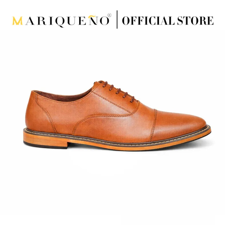 Tan brown leather shoe with 'Mariqueno' branding on a white background
#color_tan
