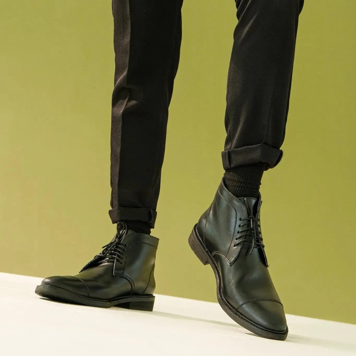 Black Chukka boots worn by a model
#color_black