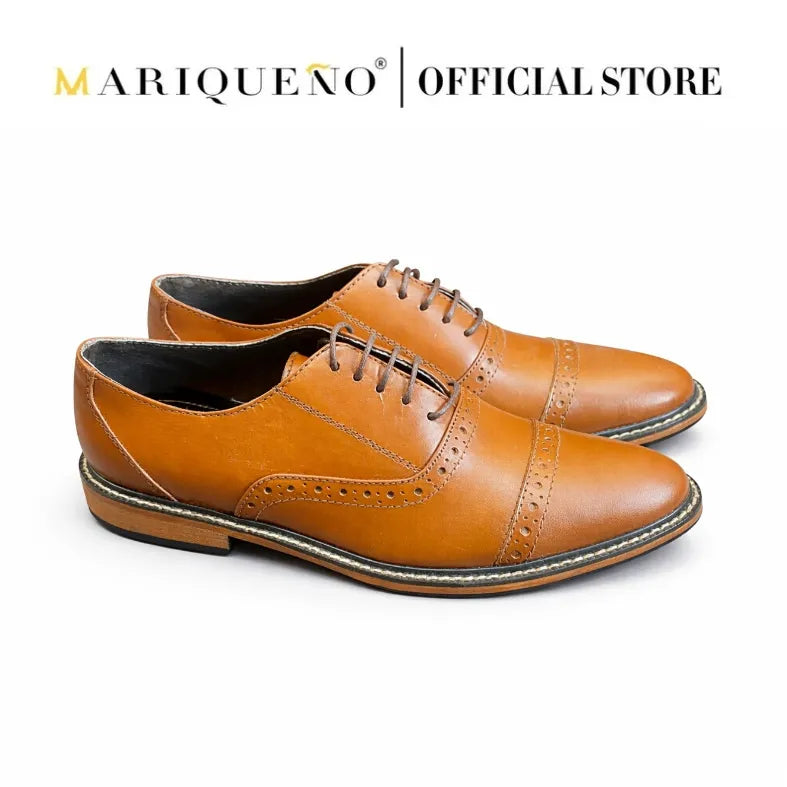 Pair of tan brown oxford leather shoes with 'Mariqueno' branding on a white background
#color_tan