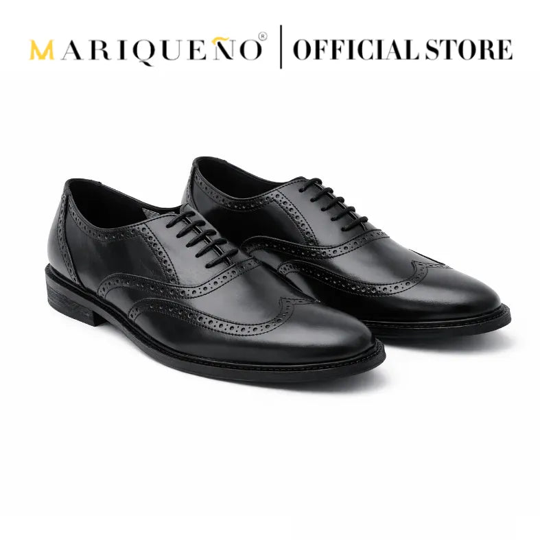 Black wingtip oxford shoes with 'Mariqueno' branding on a white background
#color_black