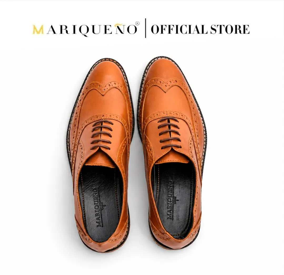 Pair of brown leather shoes with 'Marqueéno' branding on a white background
#color_tan