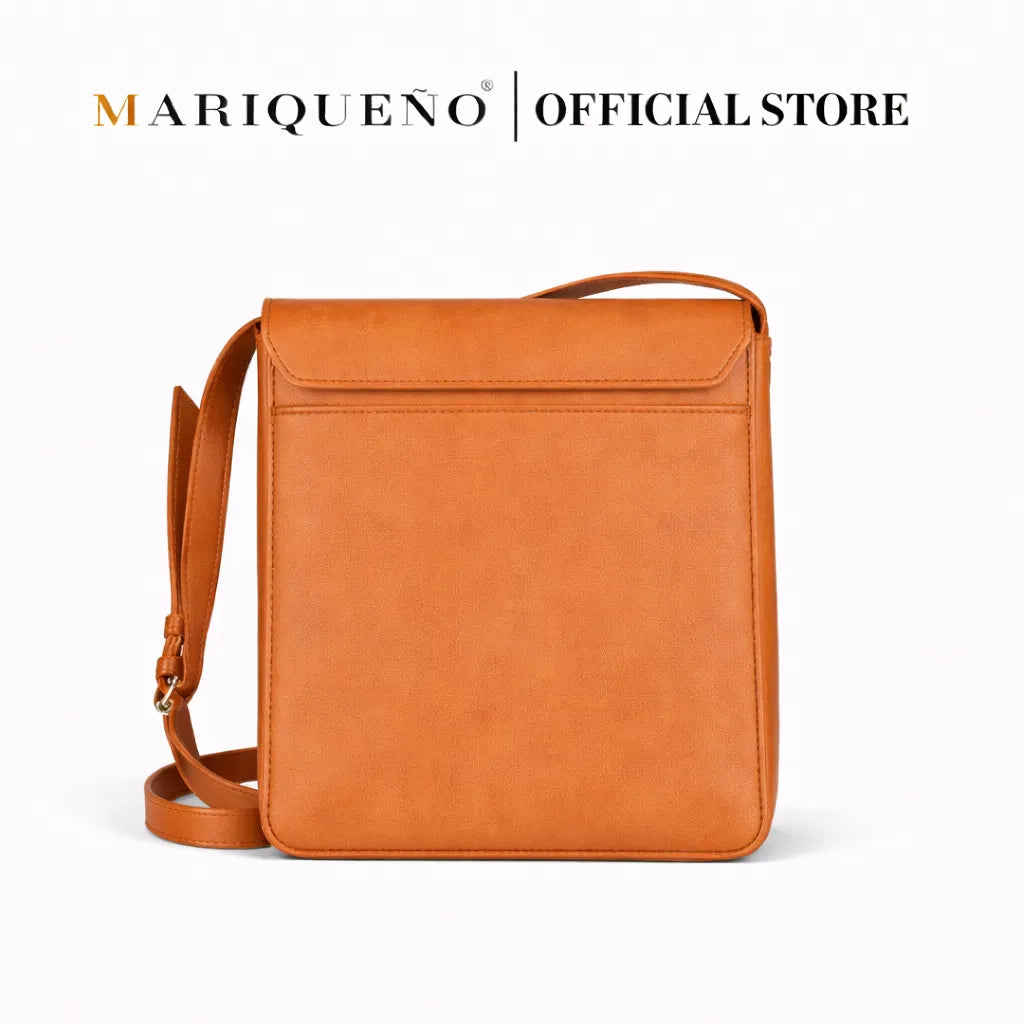 Tan brown leather bag with 'Mariqueno' branding on a white background
#color_tan