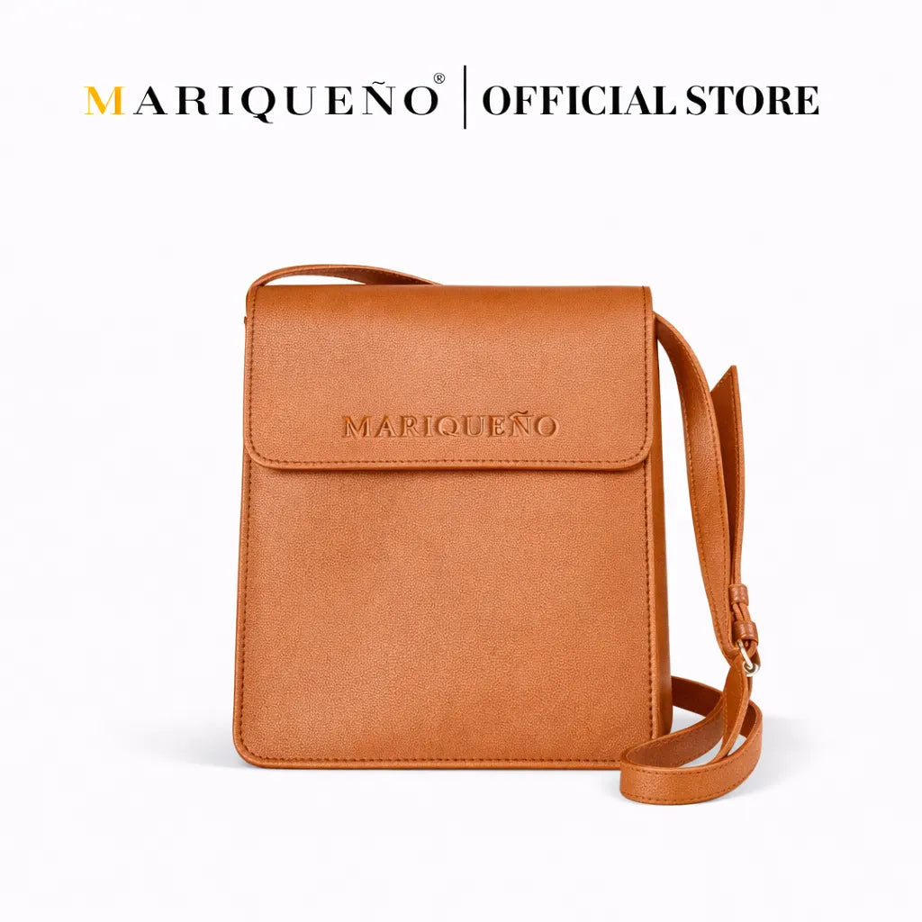 Tan brown leather crossbody bag with 'Mariqueno' branding on a white background
#color_tan