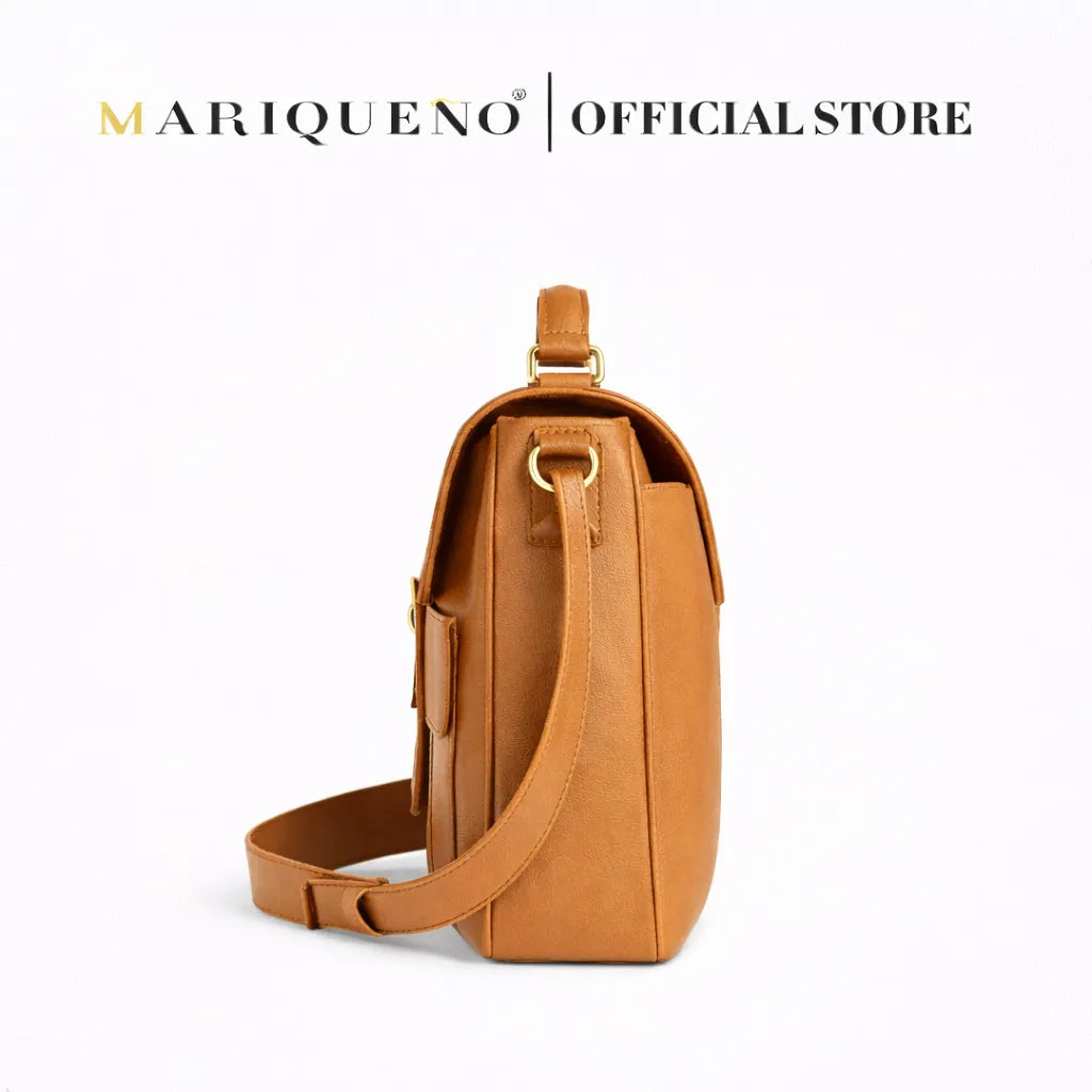 Tan leather bag with 'Mariqueno' branding on a white background
#color_tan